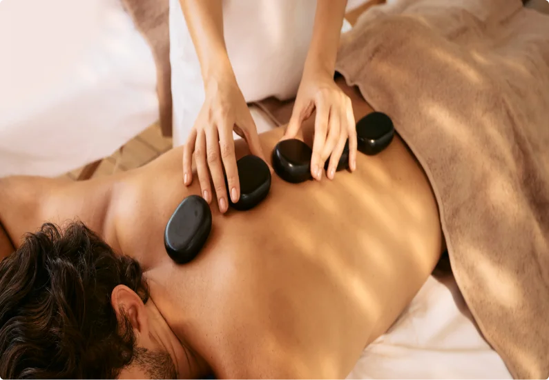 Hot stone massage on back.
